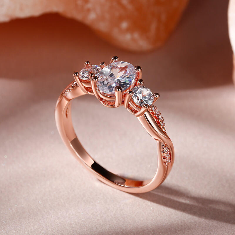 Rose Gold Twisted Oval Cut Three Stone Engagement Ring